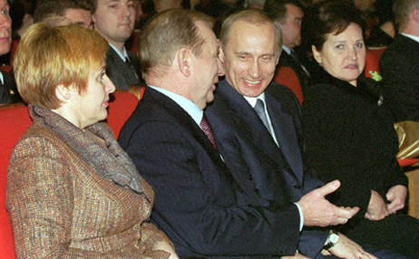Putin and Ukrainian President Leonid Kuchma with their wives at the opening of the Year of Ukraine in Russia, Nov. 29, 2001.