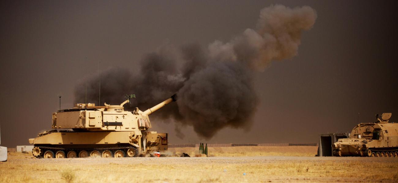 A U.S. Army M109A6 Paladin conducts a fire mission in Iraq.
