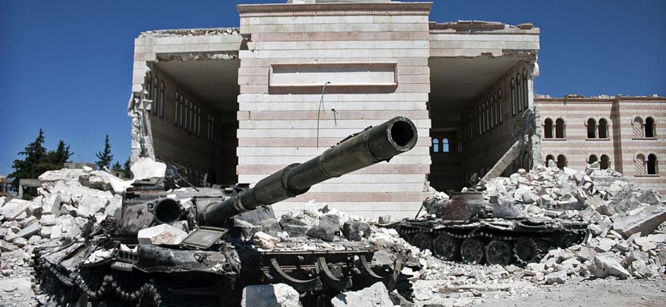 Two destroyed tanks in front of a mosque in Azaz, Syria.