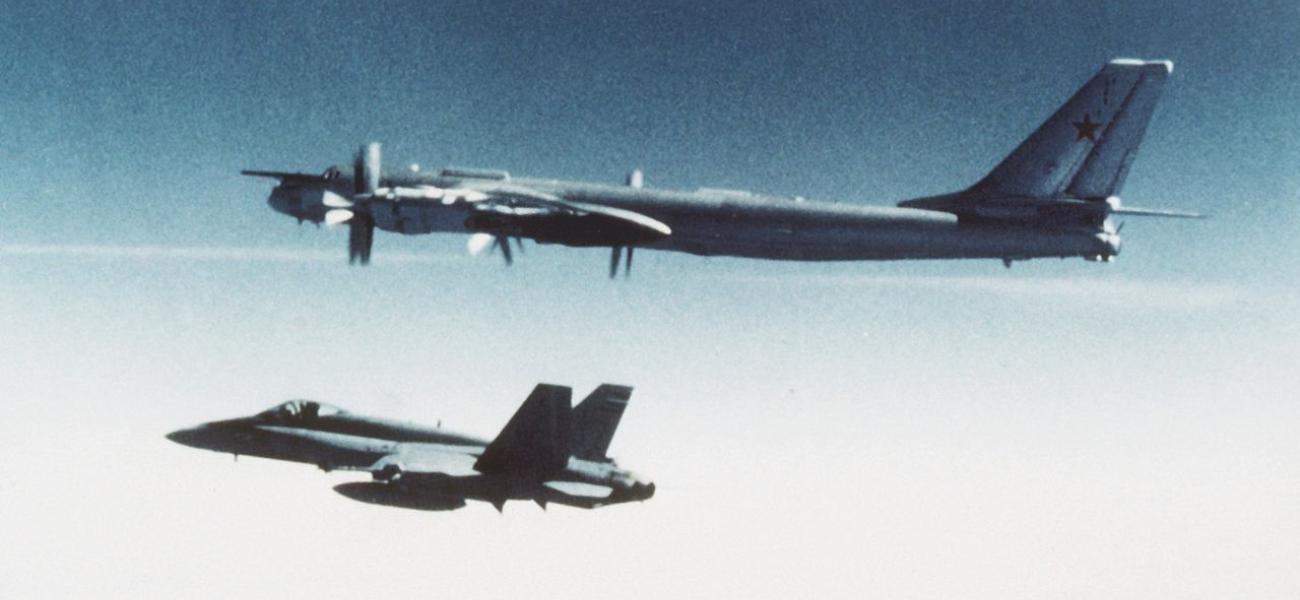 Soviet Tupolev Tu-95 is escorted by Canadian CF-18 Hornet in 1987. 