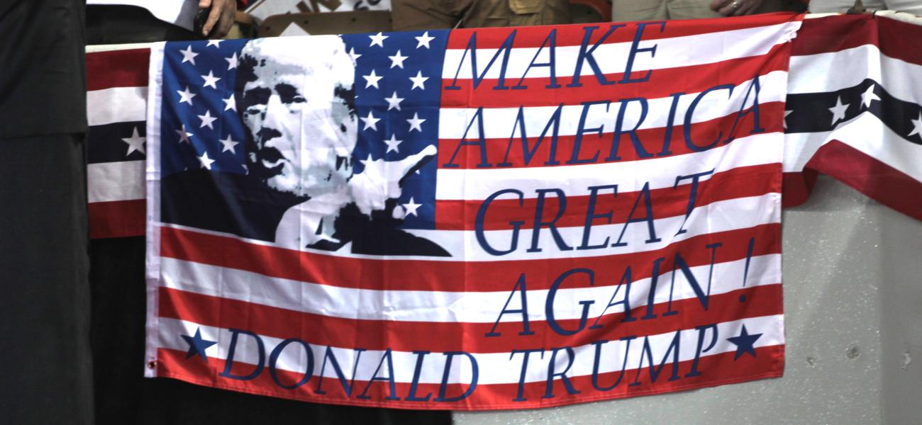 Donald Trump campaign slogan on American flag. 
