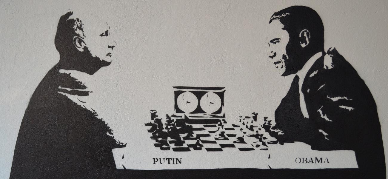A graffiti image of Russia's President Vladimir Putin playing chess with former U.S. President Barrack Obama. 