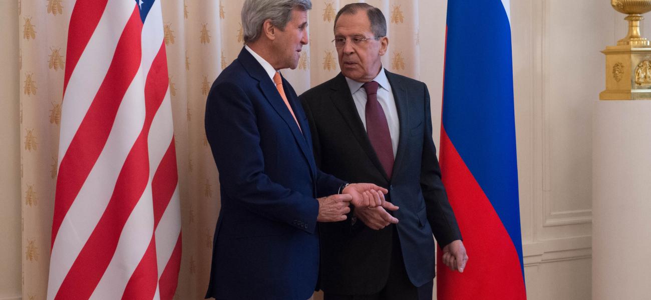 In Moscow, U.S. Secretary of State John Kerry speaks with Russian Foreign Minister Sergey Lavrov before their meeting.