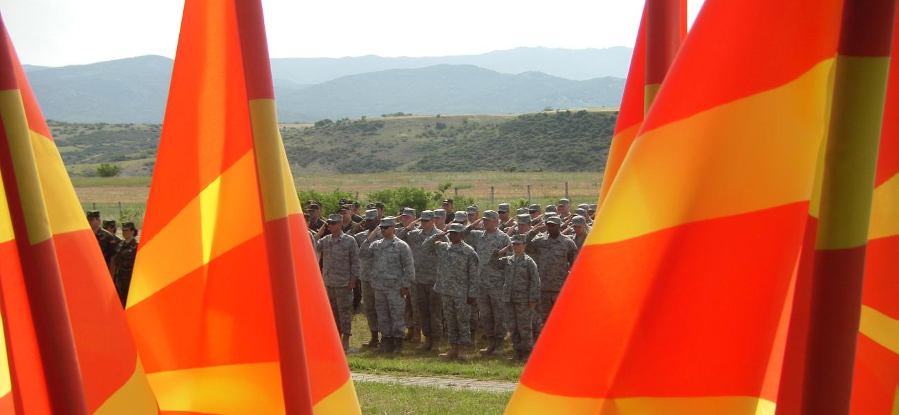 U.S. military personnel seen through Macedonian flags